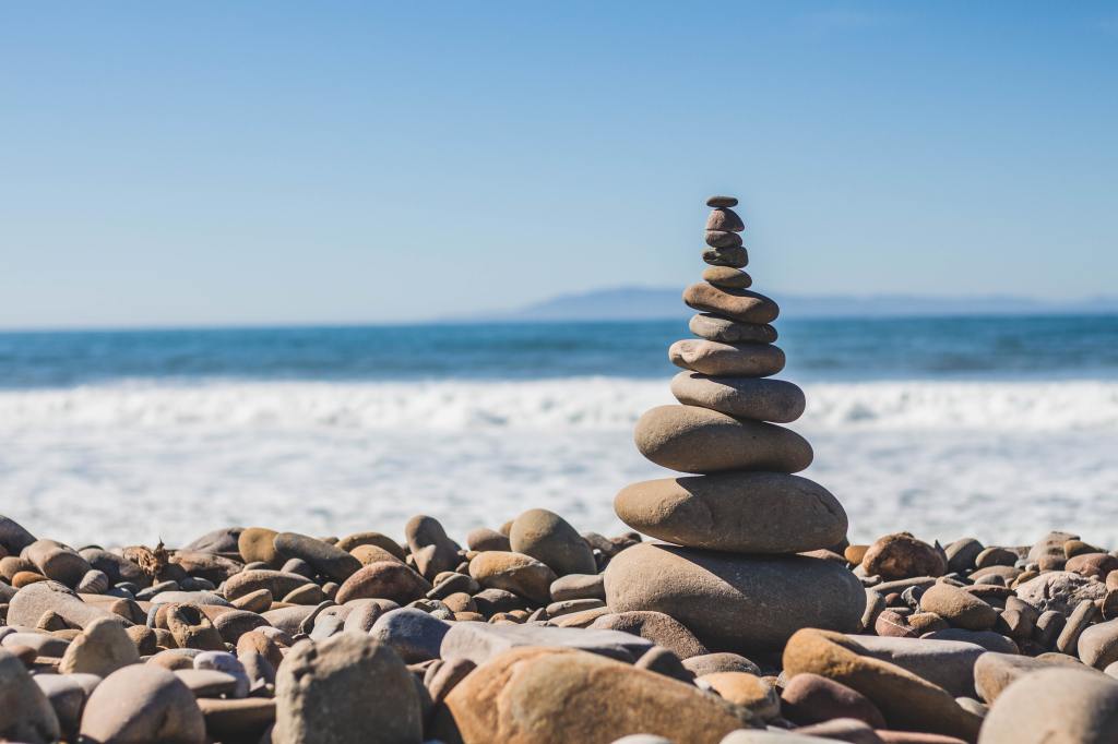Image of stone cairn on beach courtesy of Jeremy Thomas via Upsplash. Thank you!